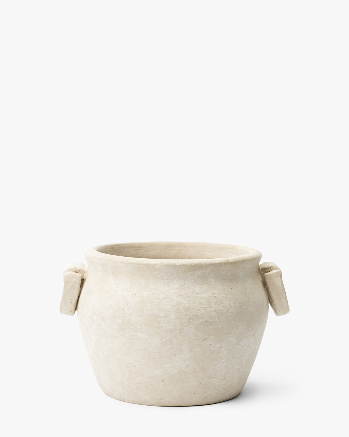 The Chelsea Planter by Terra Cotta Art Works, Inc. is a simple round beige pot featuring two small rectangular handles on each side, shown against a plain white background. McGee & Co.