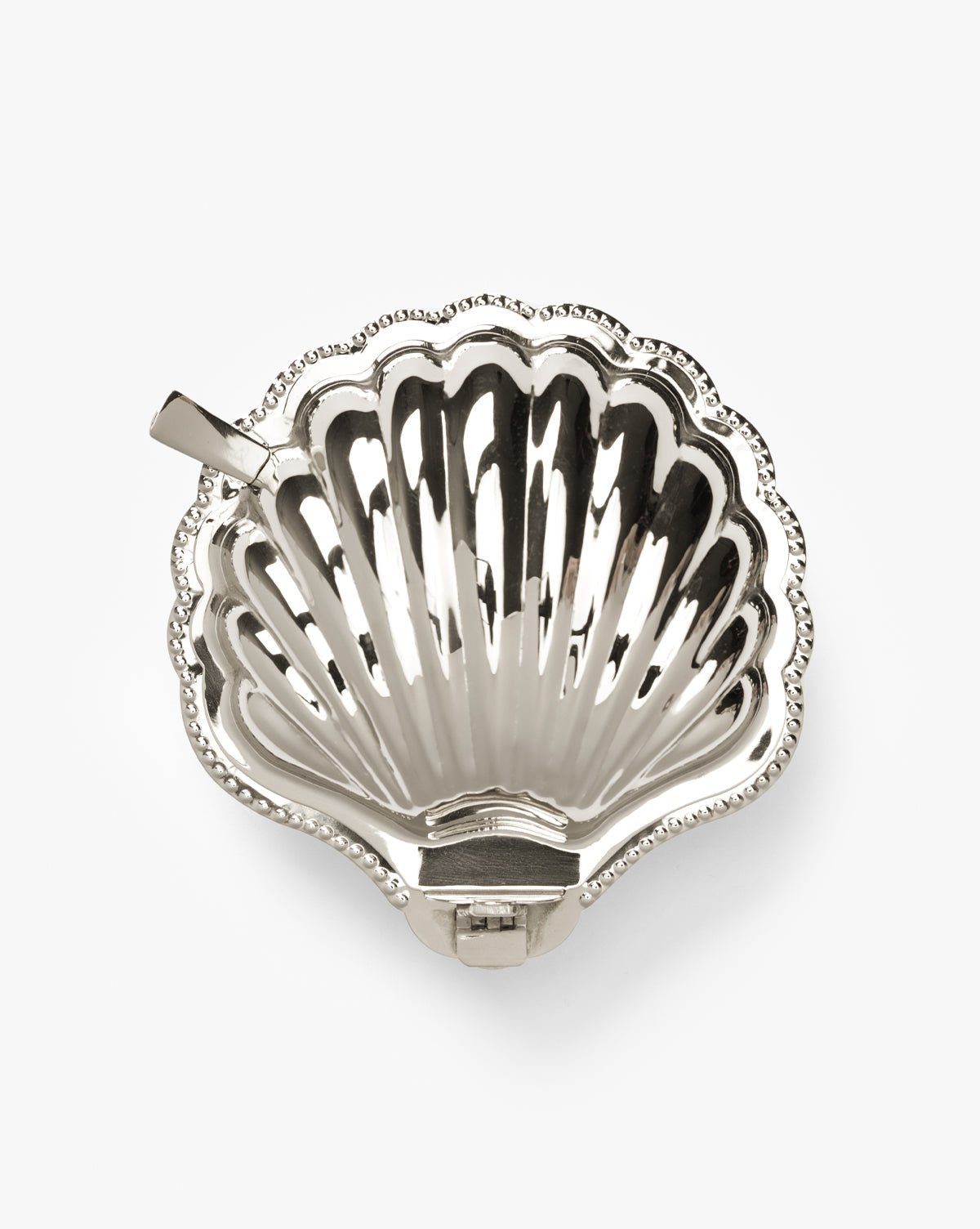 The Clam Shell Serving Dish with Spoon features detailed ridges, a beaded edge, and a flat handle—perfect for coastal-inspired entertaining with elegant nautical style, by McGee & Co.