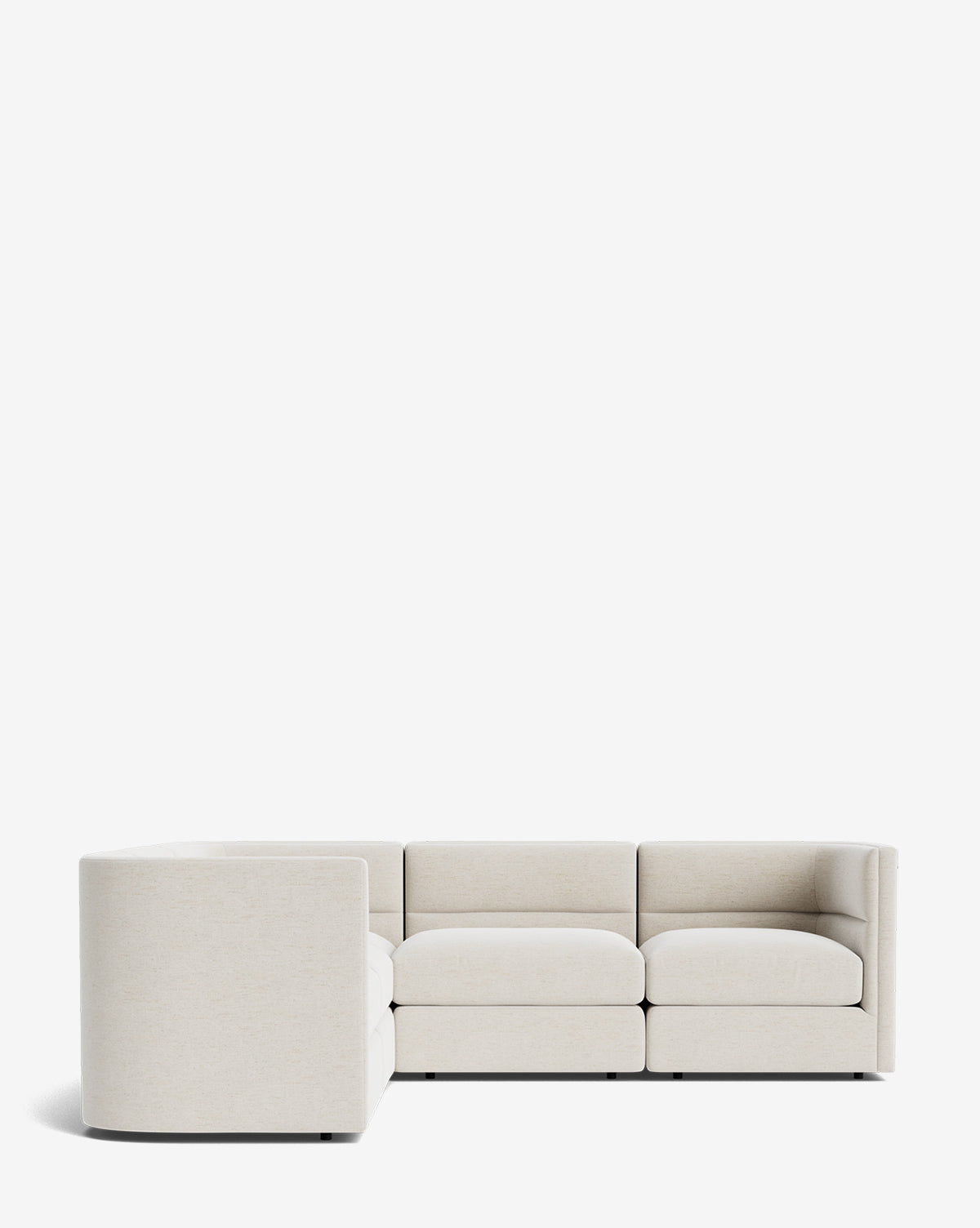 The Makerspalm Claremont Modular L Sectional 99 is upholstered in light beige fabric and features clean lines, deep seats, and a low backrest for a minimalist look. Shown here against a plain white background. McGee & Co.