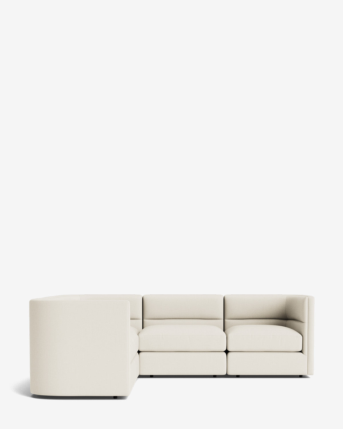 A modern, minimalist Claremont Modular L Sectional 99 in light beige fabric, featuring clean lines and low-profile back and armrests, set against a plain white background. This customizable sectional brings timeless style to any room, by McGee & Co.
