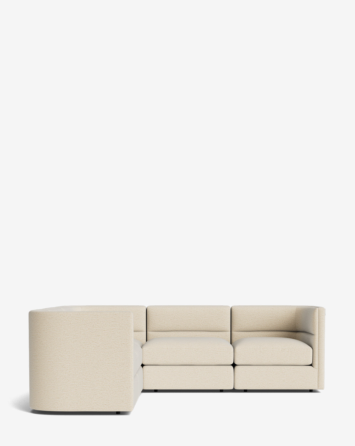 The Makerspalm Claremont Modular L Sectional 99 features three connected seats, low backrests, and a modern light beige fabric in an L-shape. Customizable for versatile styling, its shown against a plain white background. McGee & Co.