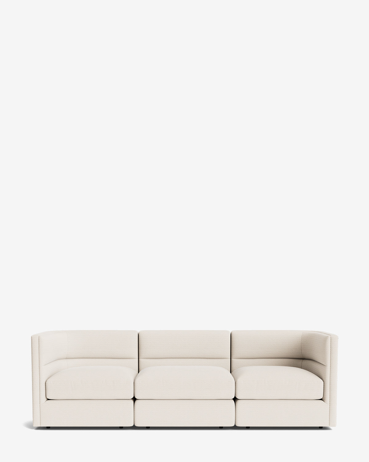 The Makerspalm Claremont Modular Sofa 99 features a modern, vintage-inspired design with a low back and armrests, upholstered in customizable light beige fabric and shown against a plain white background by McGee & Co.