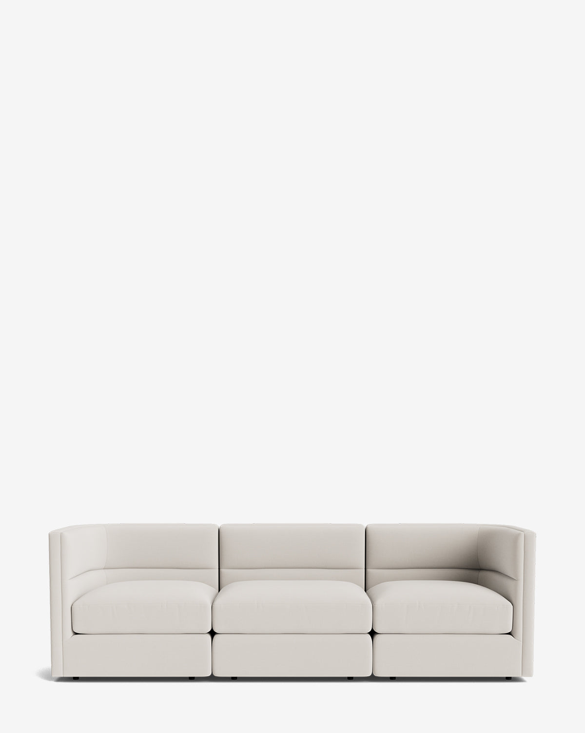 The Makerspalm Claremont Modular Sofa 99 features a modern, minimalist design with three seats, light beige upholstery, low backrests, and square armrests, shown against a plain white background. McGee & Co.