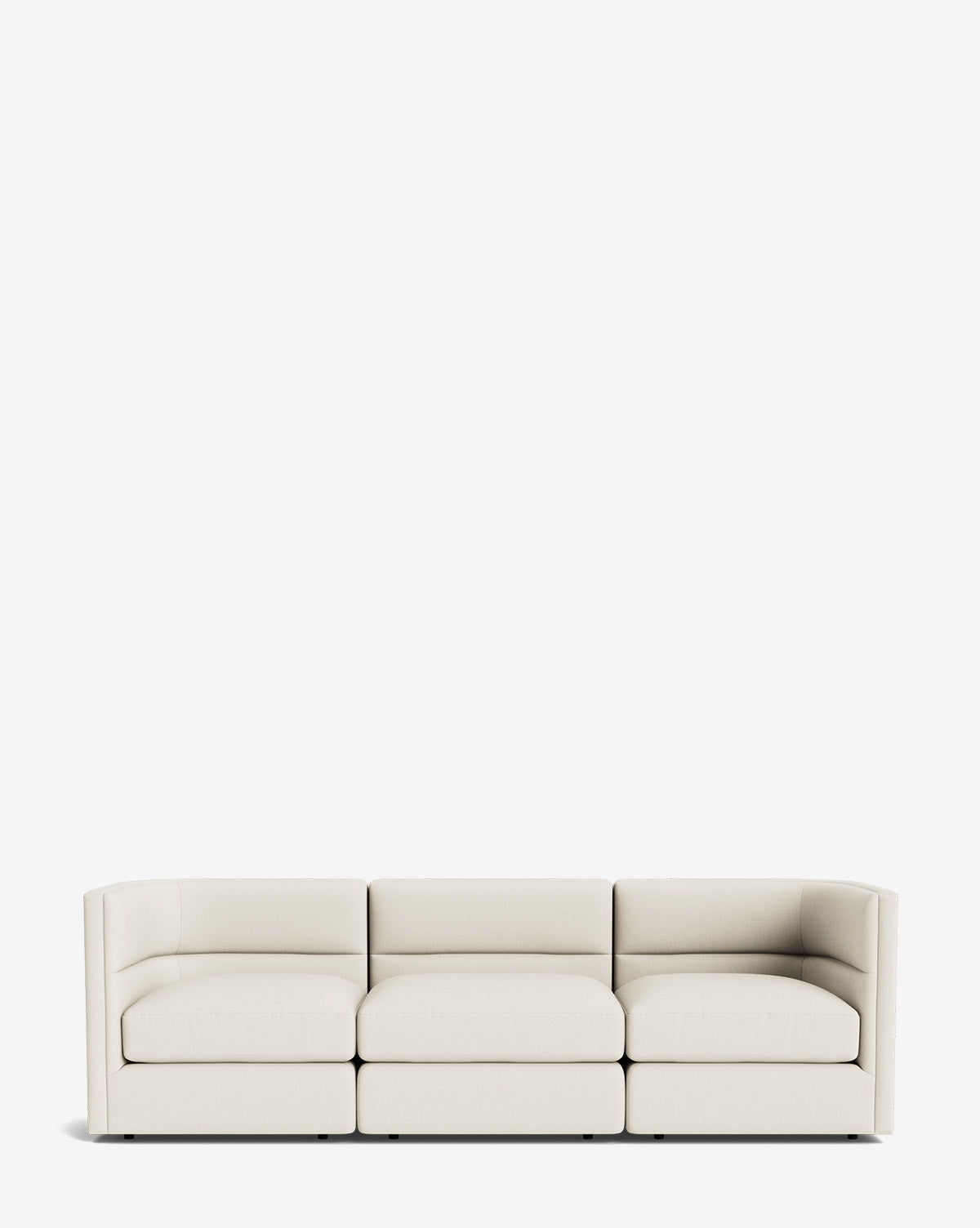 The Claremont Modular Sofa 99 is a modern three-seat sofa with light beige upholstery and low square arms, bringing luxurious comfort to any space, by McGee & Co.