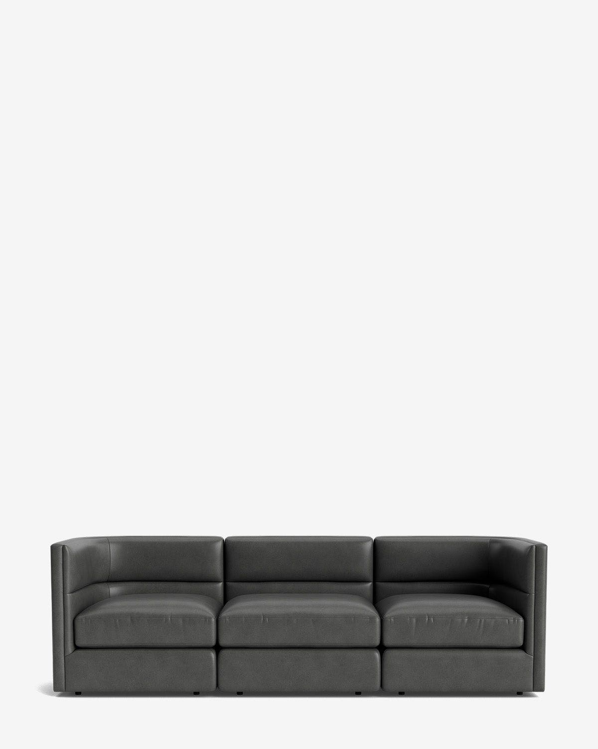 The Claremont Modular Sofa 99, a modern, dark gray leather three-seater with low armrests and backrest, sits against a plain white background by McGee & Co.