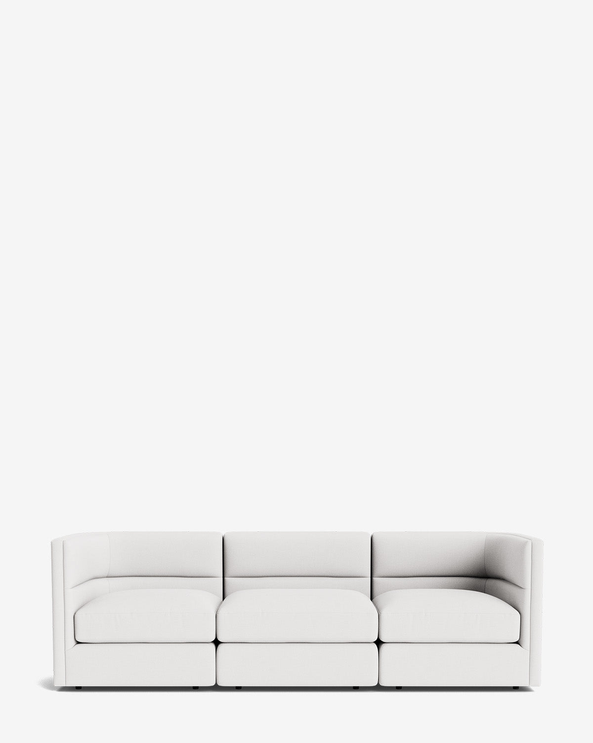 The Claremont Modular Sofa 99 is a modern, three-seat white sofa with low armrests and minimalist design, providing luxurious comfort against a plain white background, by McGee & Co.