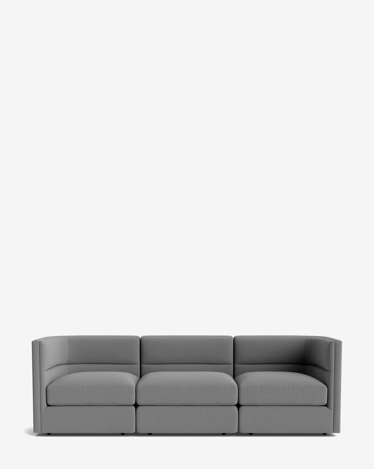 The Makerspalm Claremont Modular Sofa 99 features a modern, minimalist gray design with low armrests and a boxy shape, shown against a plain white background. McGee & Co.
