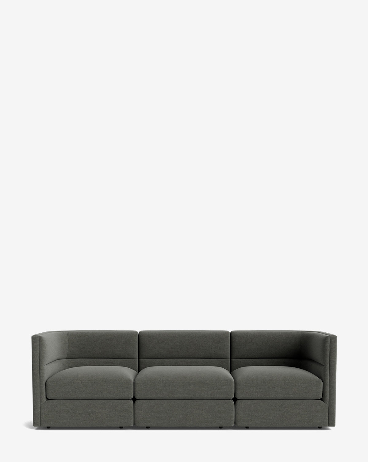 The Makerspalm Claremont Modular Sofa 99 is a modern, dark gray three-seater with low, boxy arms and backrest, shown against a plain white background. McGee & Co.
