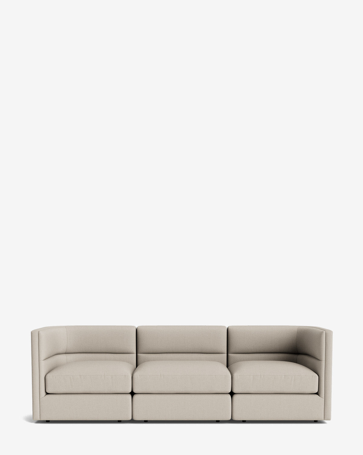 The Claremont Modular Sofa 99 is a modern, light beige three-seater with clean lines and low, boxy arms, offering luxurious comfort against a plain white background, by McGee & Co.