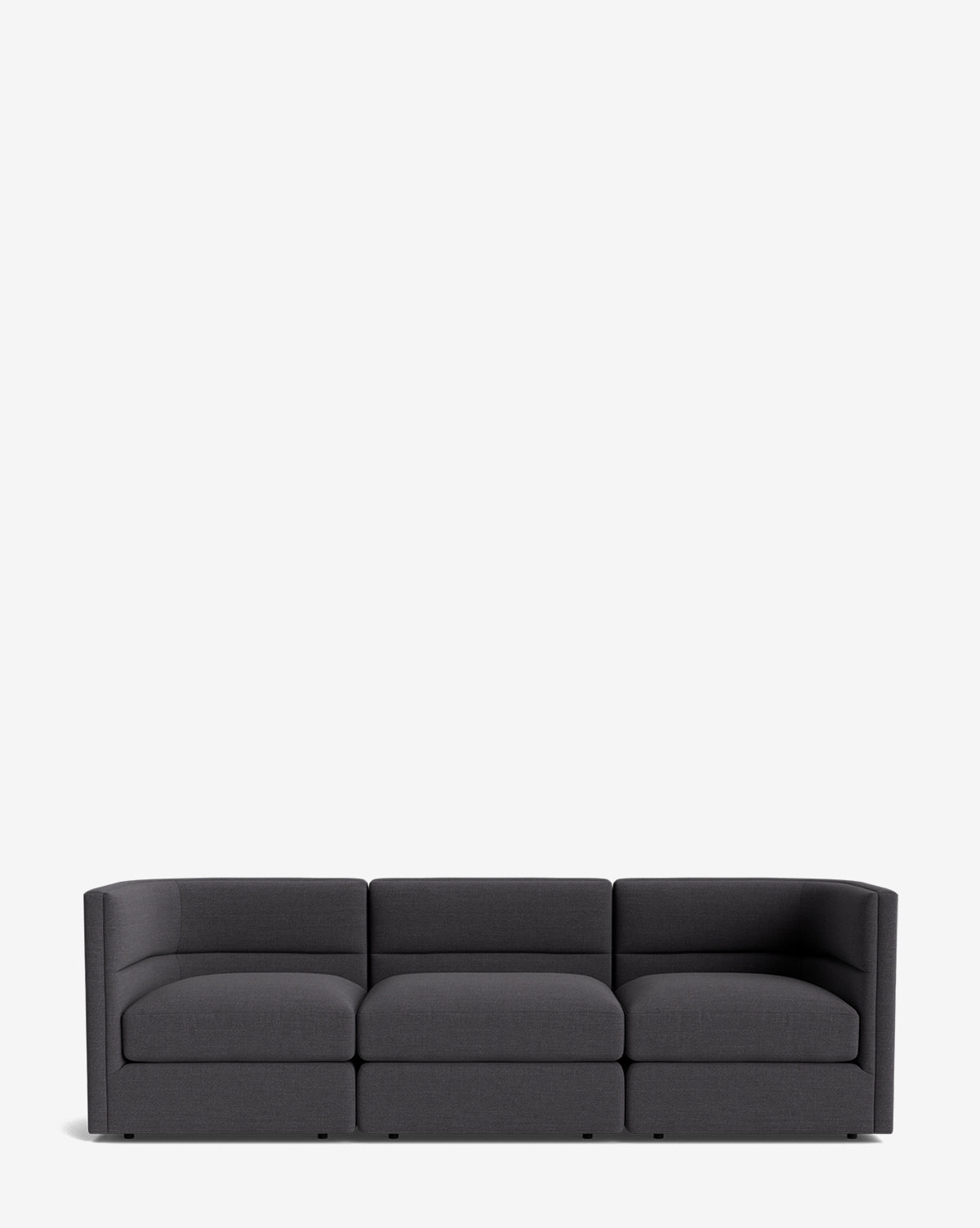 The Makerspalm Claremont Modular Sofa 99 is a modern, dark gray three-seater with clean lines and low arms, shown against a plain white background. McGee & Co.