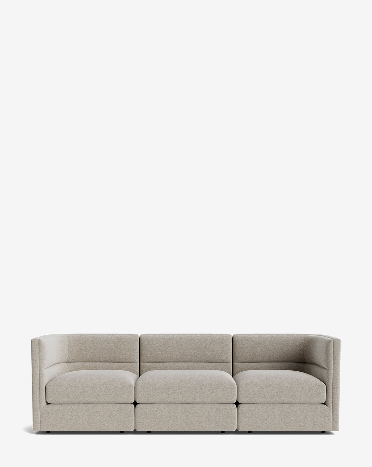 The Makerspalm Claremont Modular Sofa 99 is a modern, light-grey three-seater with low backrests and squared arms, shown against a plain white background. McGee & Co.