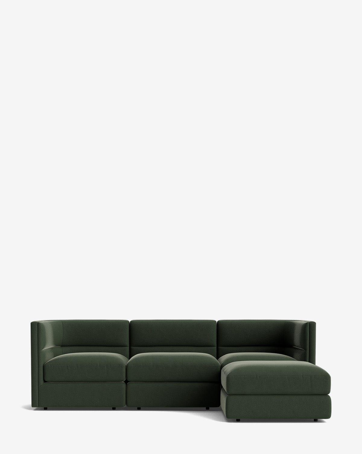 The Claremont Modular Sofa with Ottoman 99 is a modern dark green three-seater with a right-facing chaise and channeled back, shown against a plain white background by McGee & Co.
