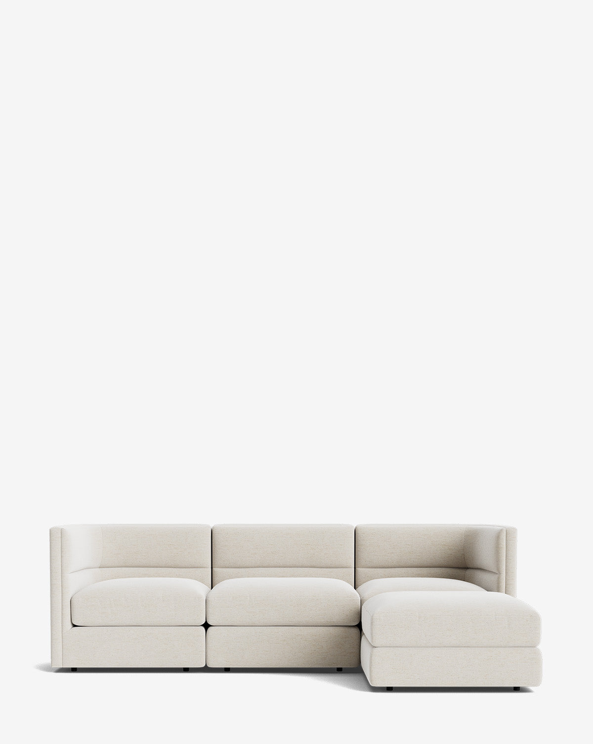 The Makerspalm Claremont Modular Sofa with Ottoman 99 features three seats, a right-facing chaise, and light beige plain fabric upholstery, shown against a white background. McGee & Co.