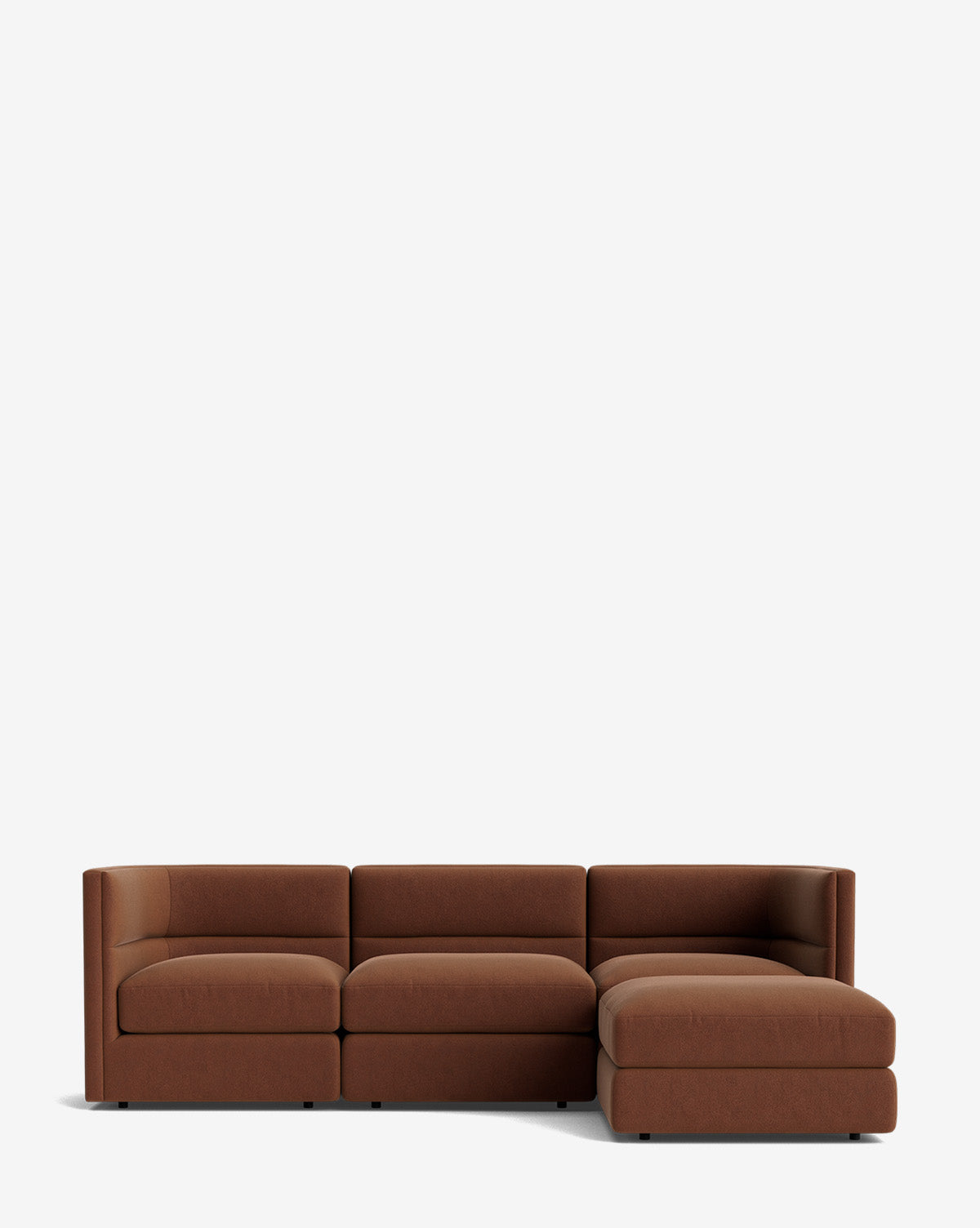 The Makerspalm Claremont Modular Sofa with Ottoman 99 is a modern, minimalist brown sectional with wide seating and low backrests, featuring a right-side chaise lounge, perfect for versatile comfort in contemporary spaces. McGee & Co.