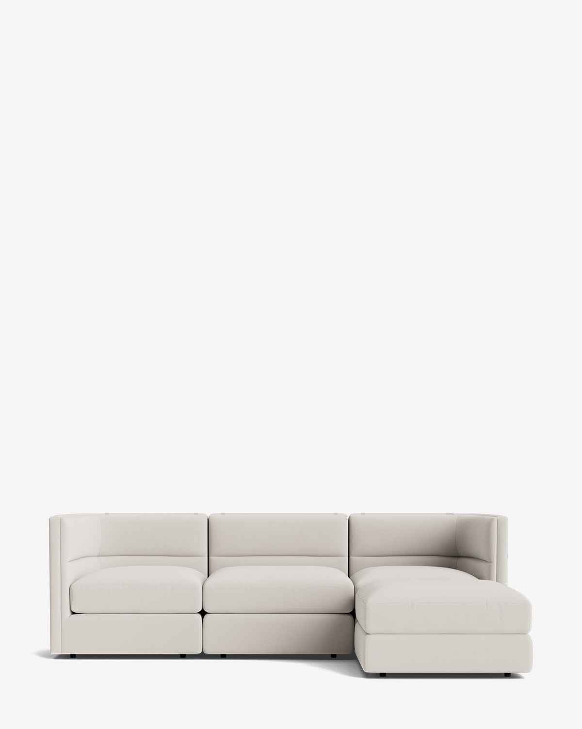 The Makerspalm Claremont Modular Sofa with Ottoman 99 features a modern, light beige design with three seat cushions and a right-side chaise, showcasing clean lines and minimalistic style against a plain white background by McGee & Co.