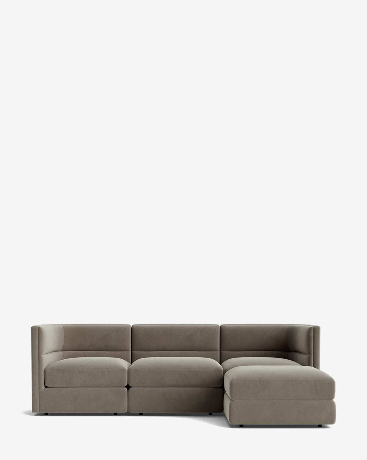The Claremont Modular Sofa with Ottoman 99 is a modern light gray sectional featuring clean lines, low-back cushions, three seat sections, and a right-side chaise lounge, shown against a plain white background by McGee & Co.