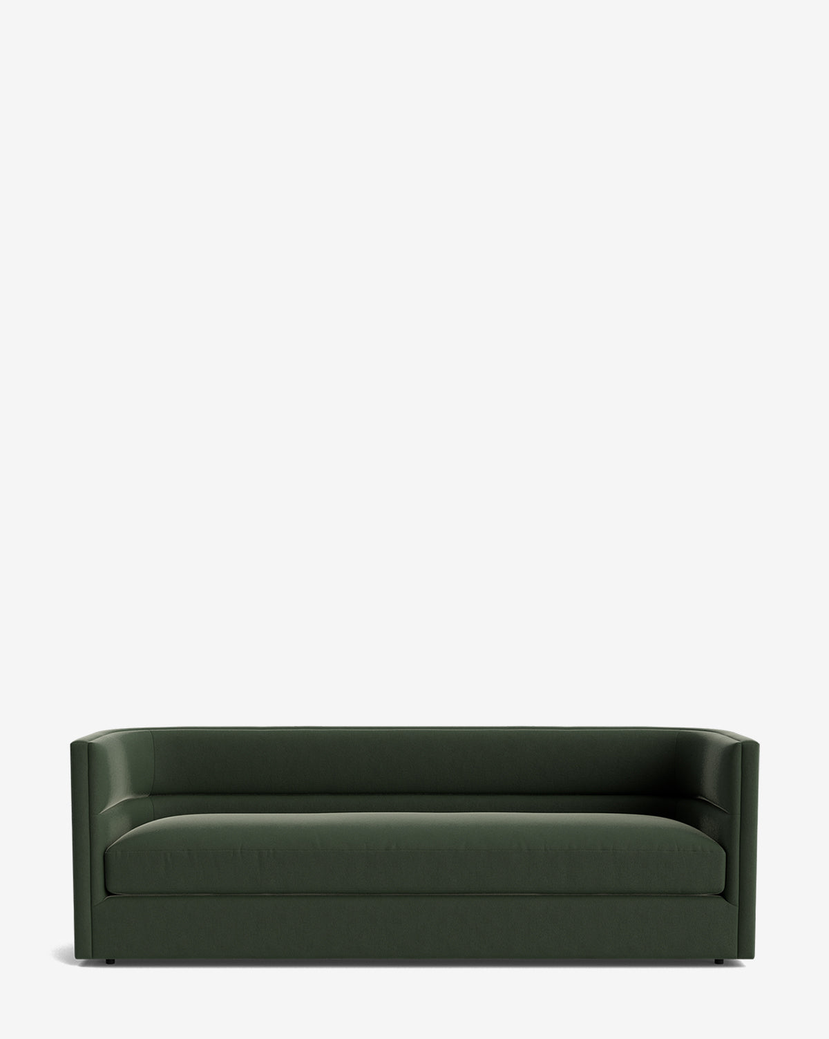 The Claremont Sofa 84, a modern dark green piece with clean lines, low back, and slightly curved arms, is crafted from high-quality fabric and displayed against a plain white background by McGee & Co.