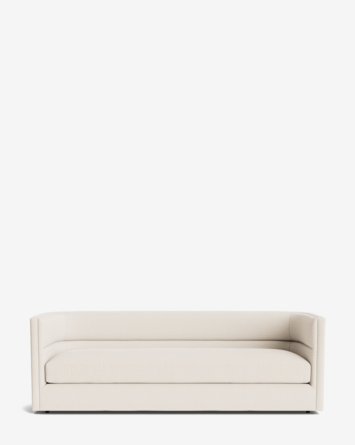 The Claremont Sofa 84 is a modern, minimalist beige sofa with low arms and a straight backrest, crafted from high-quality fabric and photographed against a plain white background by McGee & Co.
