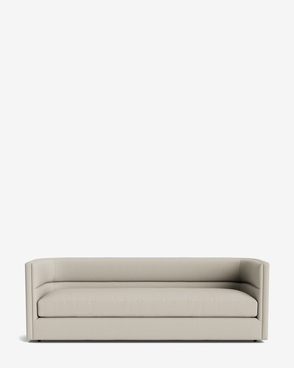 The Claremont Sofa 84 is a modern, minimalist beige sofa with straight lines, a low back, and squared armrests, crafted from high-quality fabric and showcased against a plain white background by McGee & Co.