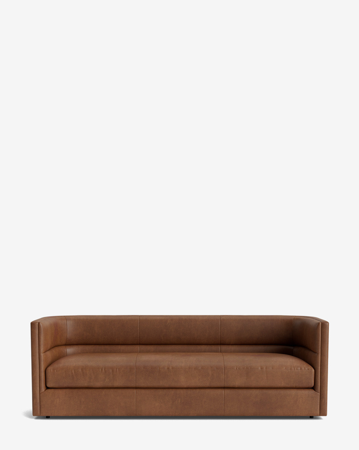 A modern, low-profile Claremont Sofa 84 in brown leather with straight arms and clean lines, set against a white background—a vintage-inspired piece designed for timeless style, by McGee & Co.