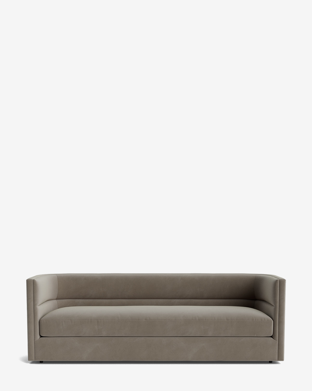 The Claremont Sofa 84 features high-quality fabric upholstery, straight lines, a low backrest, and raised armrests for a modern, minimalist look. Its sleek silhouette sits directly on the floor with no visible legs, by McGee & Co.