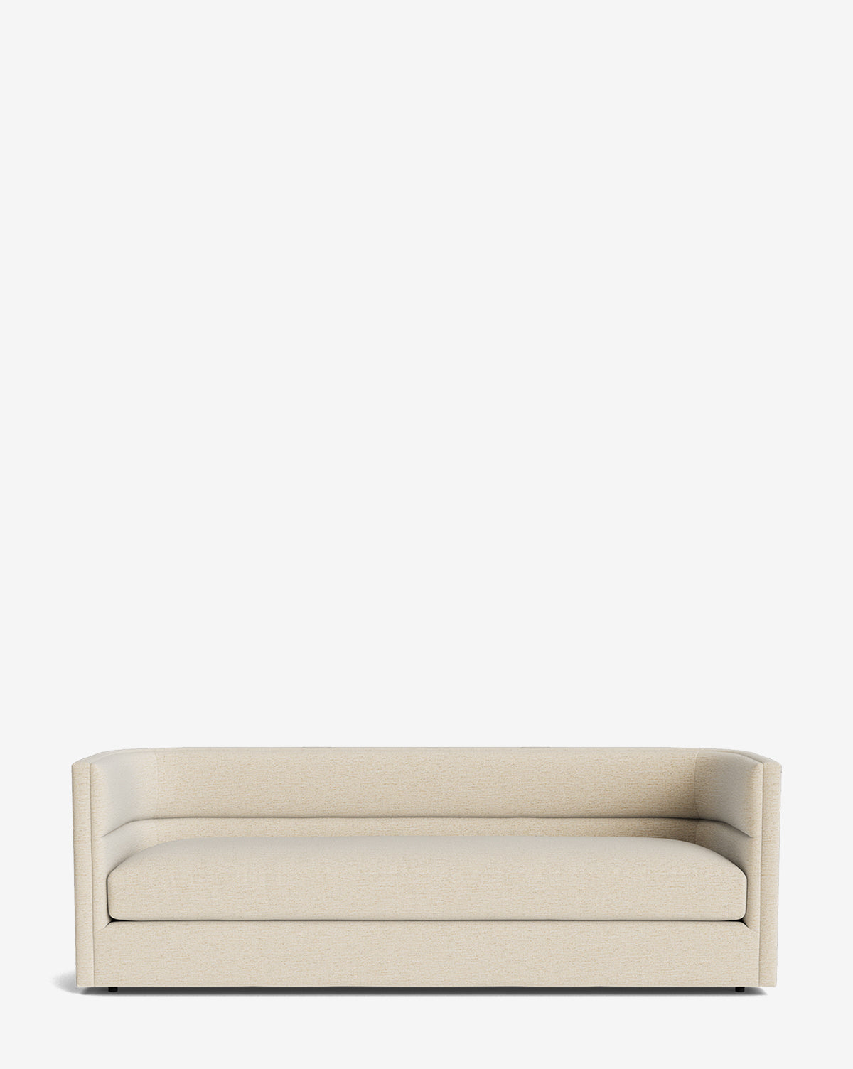 The Claremont Sofa 84 is a modern, minimalist piece in high-quality fabric with low armrests, a straight back, and clean lines. Its sleek design lacks visible decorative details and is photographed against a plain white background by McGee & Co.