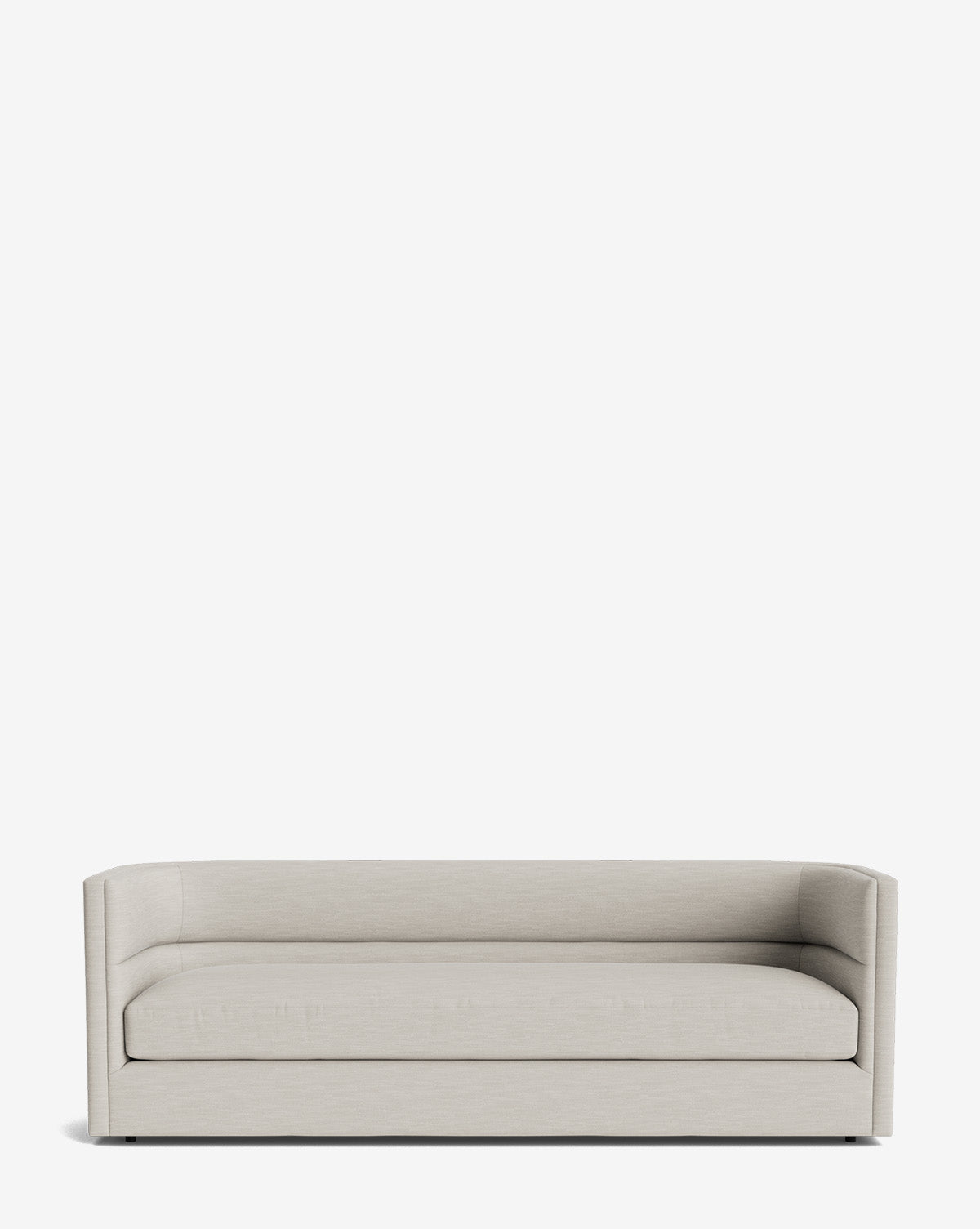 The Claremont Sofa 84 is a modern, minimalist piece in light beige with low arms and a rectangular shape. Set against a plain white background, it features clean lines and high-quality upholstery for lasting comfort by McGee & Co.