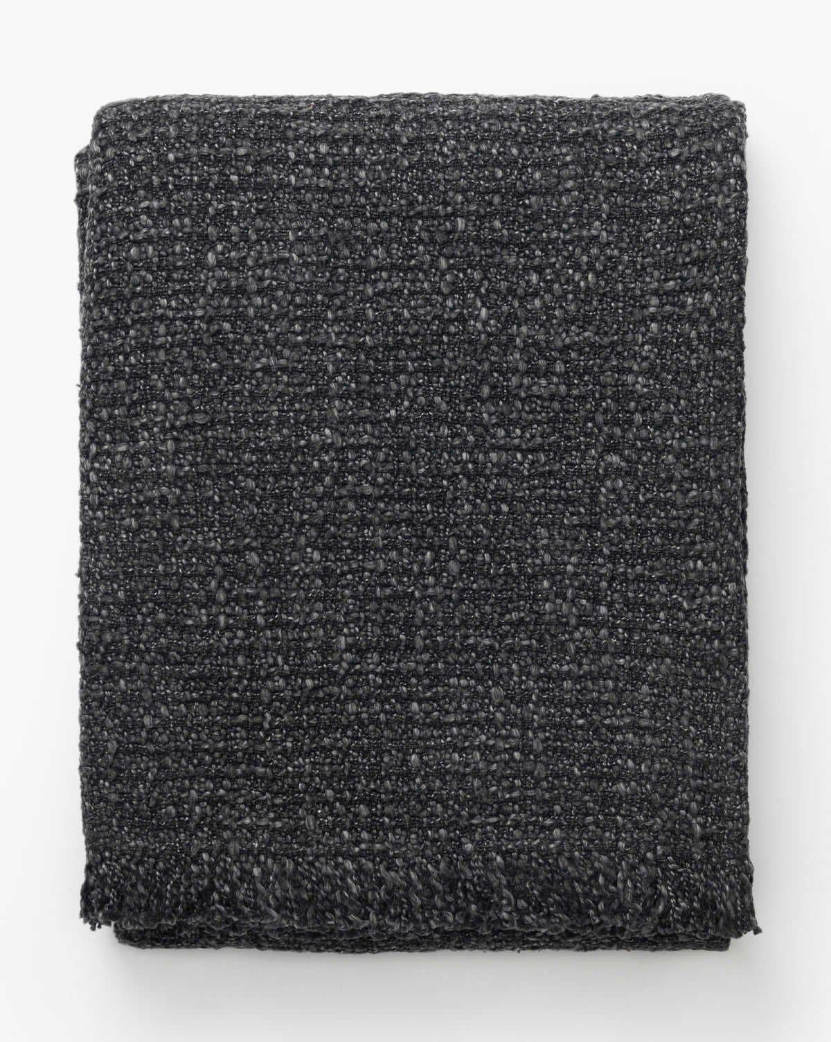 The Clarissa Throw Blanket by Creative Co-op features a soft boucle texture and subtle woven pattern in charcoal, shown neatly folded against a white background, McGee & Co.
