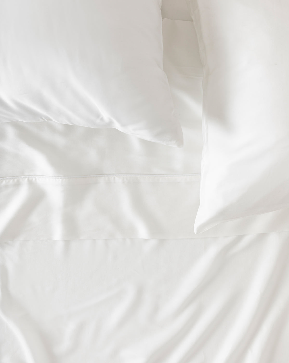 Close-up of 100% Tencel sateen weave highlighting soft sheen and detail from McGee & Co.