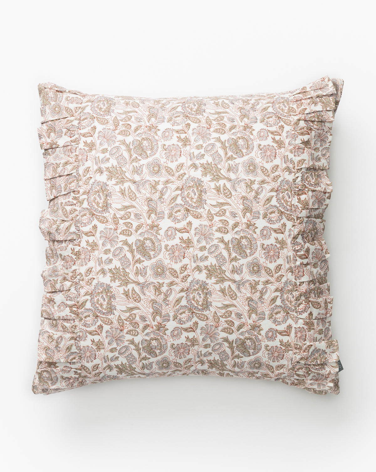 The Clea Ruffle Pillow Cover features a delicate floral pattern in muted pink, beige, and green on a light background. Photographed on a plain white surface, its perfect for adding a decorative touch to your bedding by McGee & Co.