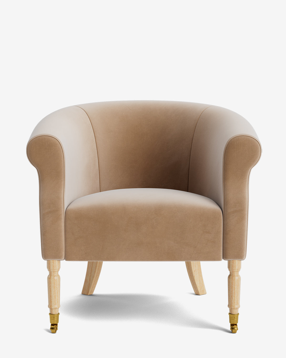 The Clemence Lounge Chair is a beige velvet armchair with rounded arms, a curved backrest, and four light wooden legs with gold castors. Its designer upholstery adds elegance to any living room setting, by McGee & Co.