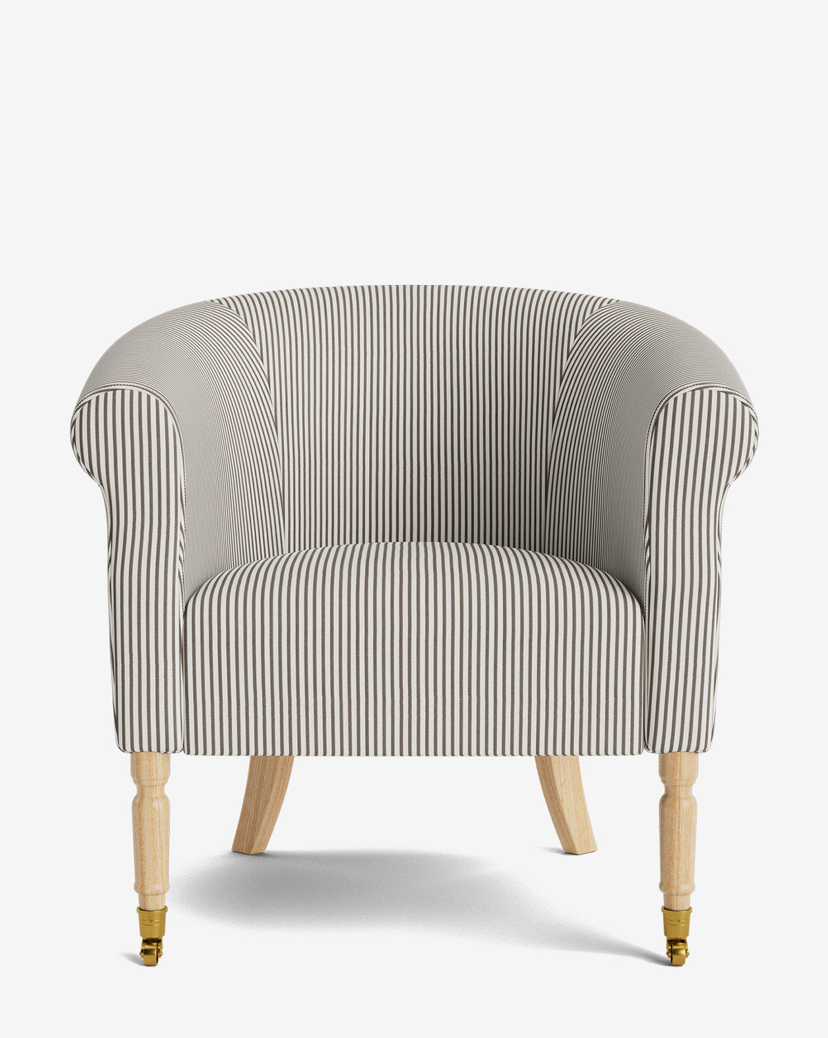 The Clemence Lounge Chair features designer striped upholstery, rounded arms and back, light wood legs, and brass castors on the front—making it a classic choice for any living room, by McGee & Co.