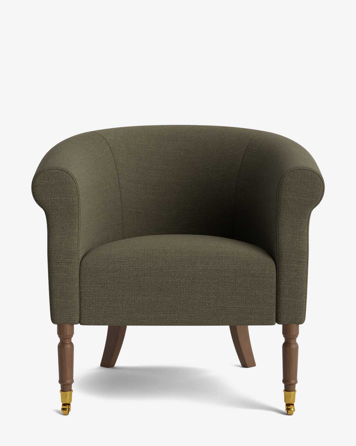 The Clemence Lounge Chair features green designer fabric upholstery, rounded arms, wooden legs, and brass castor wheels on the front legs, displayed against a plain white background by McGee & Co.