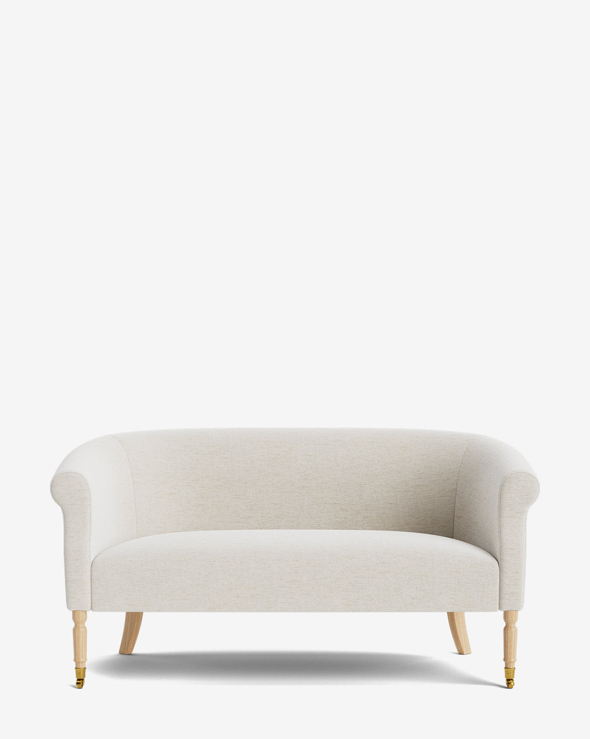 The Clemence Settee 60 by Makerspalm features a beige designer fabric upholstery, curved arms, rounded backrest, and light wood legs with front brass-capped castors—an elegant addition to any living space by McGee & Co.