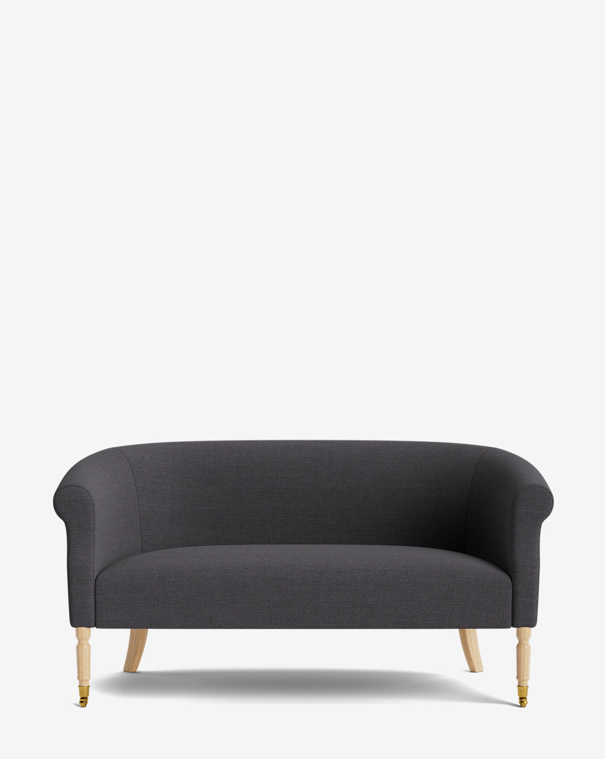 The Clemence Settee 60 by Makerspalm features dark gray designer fabric, curved arms, a rounded back, and light wooden legs—an elegant piece ideal for elevating any living space. Photographed against a plain white background. McGee & Co.