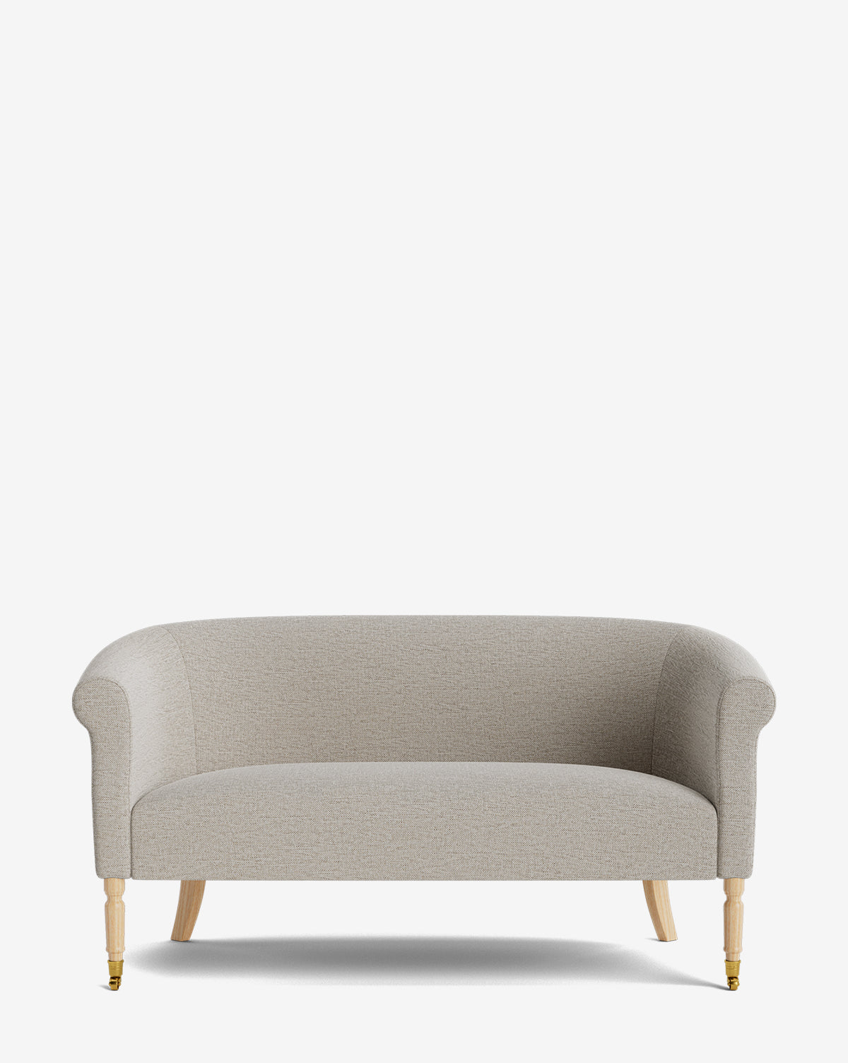 The Clemence Settee 60 features light gray designer fabric upholstery, rolled arms, and wooden legs with brass caster front wheels. Perfect for elevating any living space. Shown on a plain white background by McGee & Co.