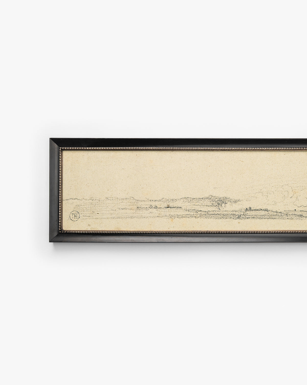 Clouded Island is a horizontal, rectangular giclée on paper showcasing a minimalist landscape sketch on beige. Its black frame with a slim gold inner lining brings elegance, while only part of the artwork is visible in the image, by McGee & Co.