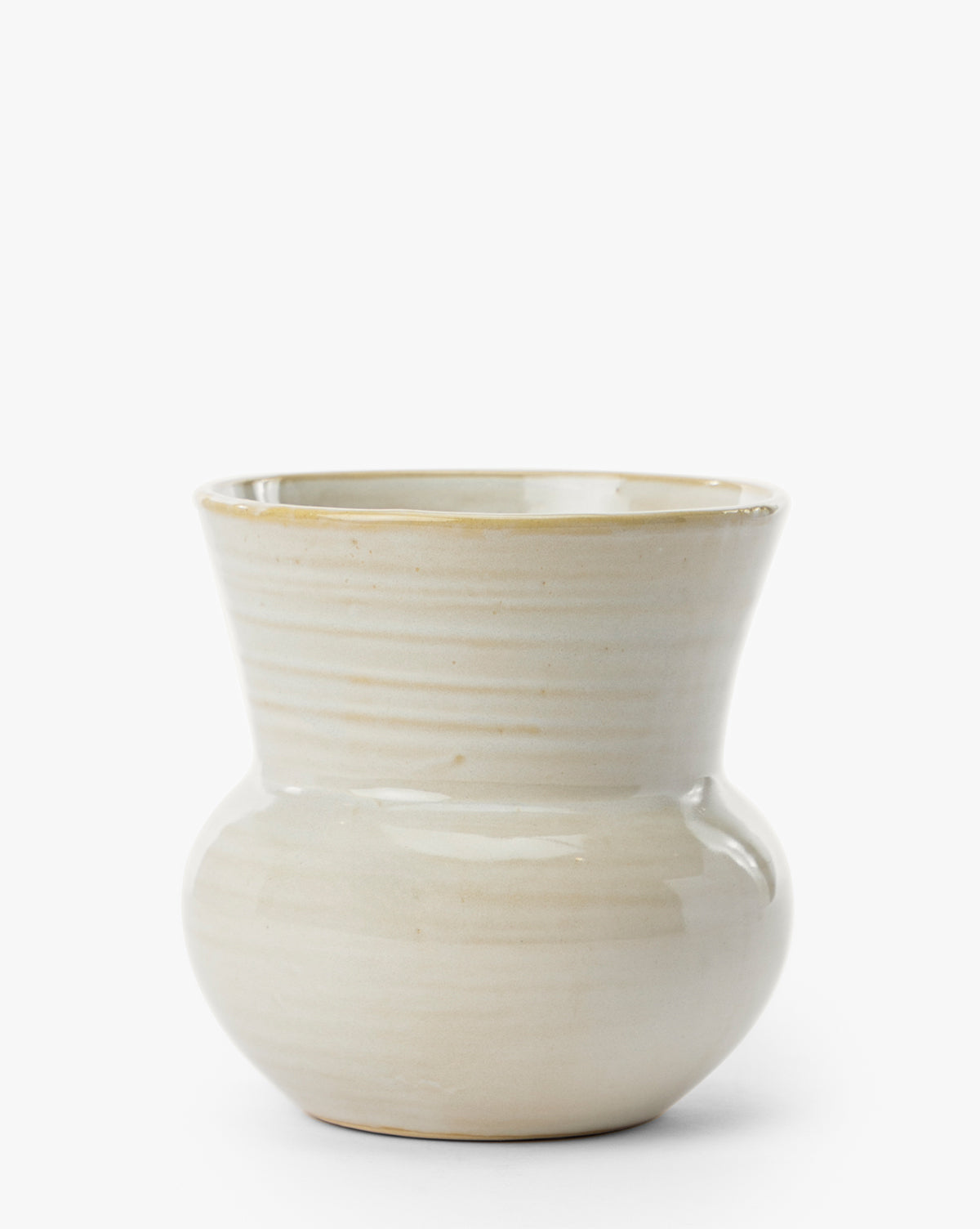 The Colchester Planter features a cream color, rounded base, flared rim, and smooth glossy ceramic finish—an elegant accent for home decor—shown on a plain white background, by McGee & Co.