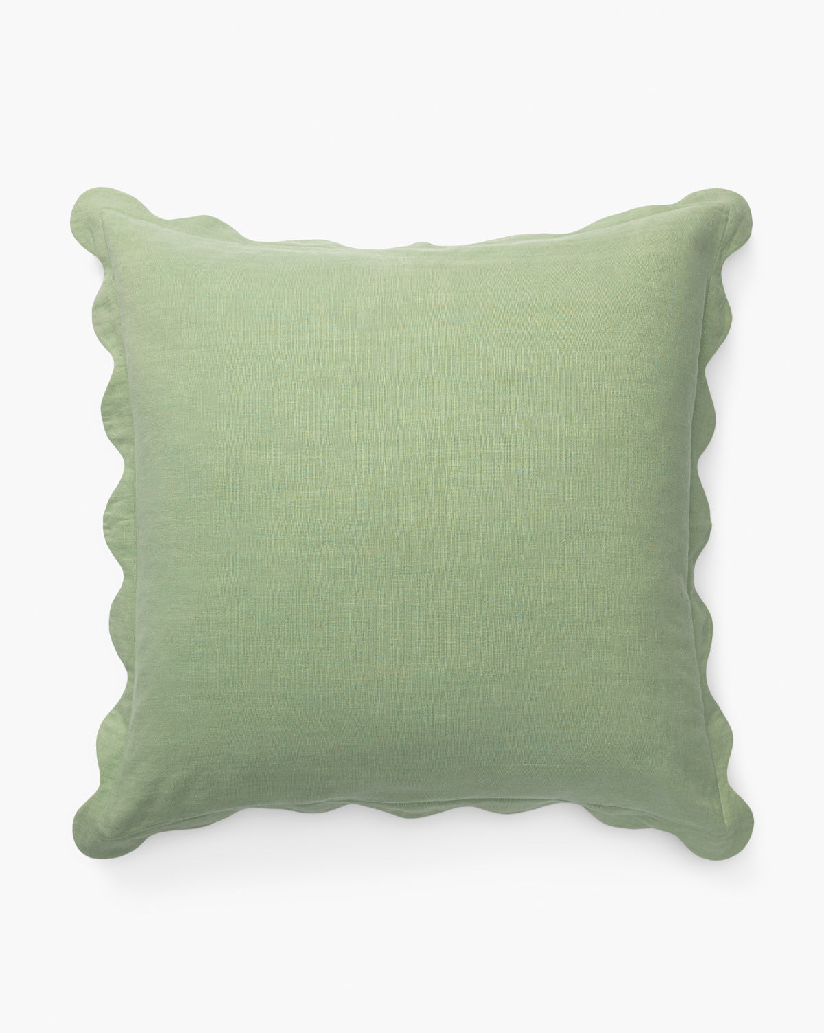 The McGee & Co. x Loeffler Randall Colette Scallop Border Pillow Cover is square, light green linen with gently scalloped edges, shown against a plain white background by McGee & Co.