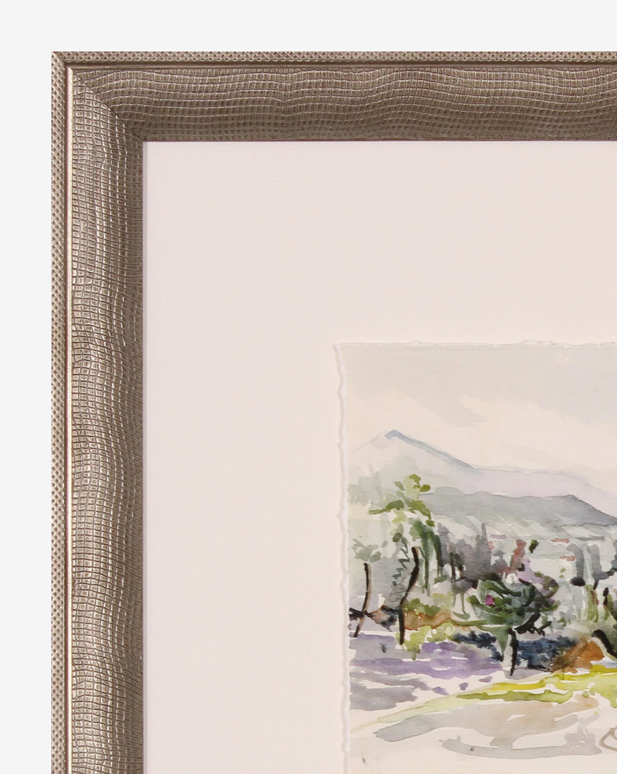 Close-up of the Colorful Landscape giclee print in a gold textured frame, showing part of the vibrant artwork with mountains, trees, and a path. Only the upper left corner of the frame and artwork are visible.