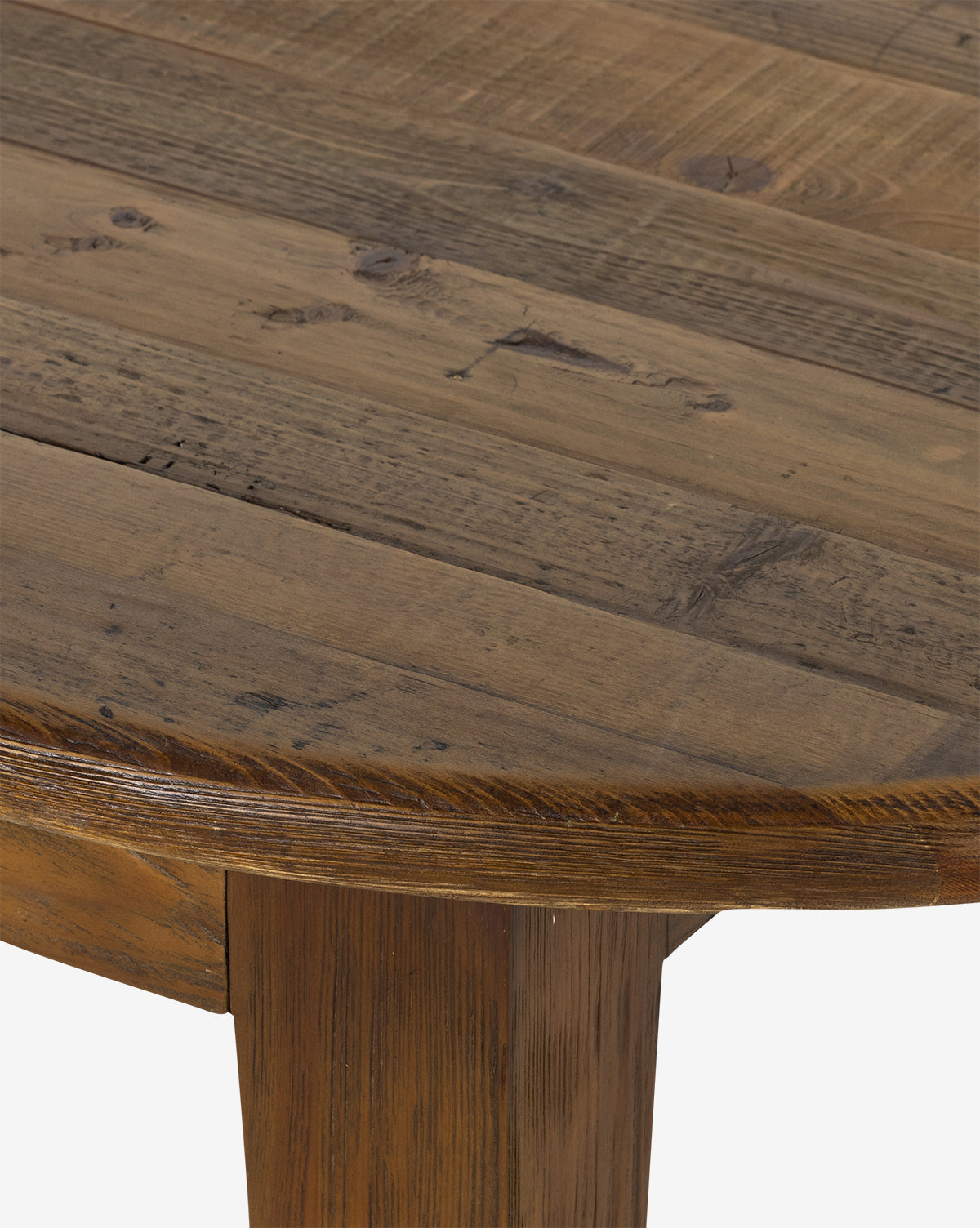The Constance Dining Table features a rustic plank-style top and solid pine legs, blending modern farmhouse charm and highlighting the woods natural grain, knots, and texture, by McGee & Co.