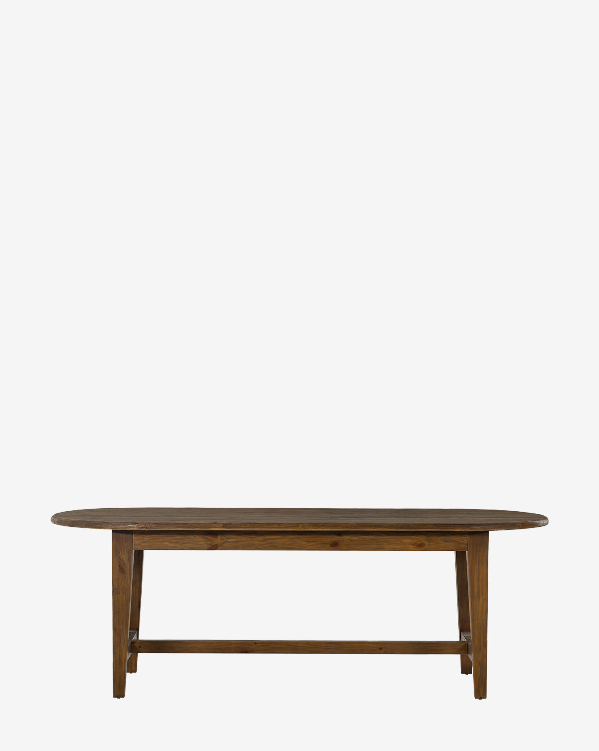 The Constance Dining Table boasts a solid pine oval top with simple legs and crossbar support, offering lasting durability and adding modern farmhouse charm to your space, by McGee & Co.