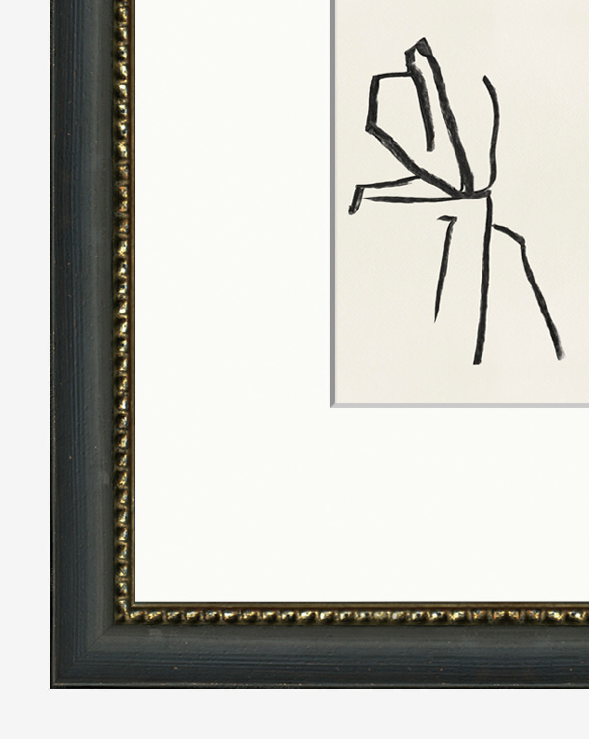 A close-up of the Contemplative Figure shows black brushstroke lines on white, with a dark frame featuring a gold beaded inner edge. Only part of this minimalist wall art and its frame is visible.