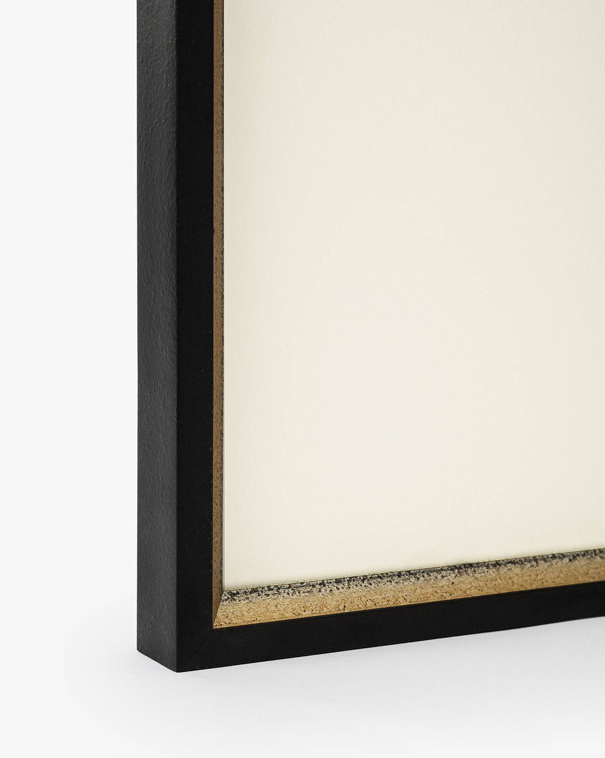Close-up of the corner of Country Dusk, a framed giclee print with a black and gold textured frame featuring clean, modern lines against a white background, by McGee & Co.