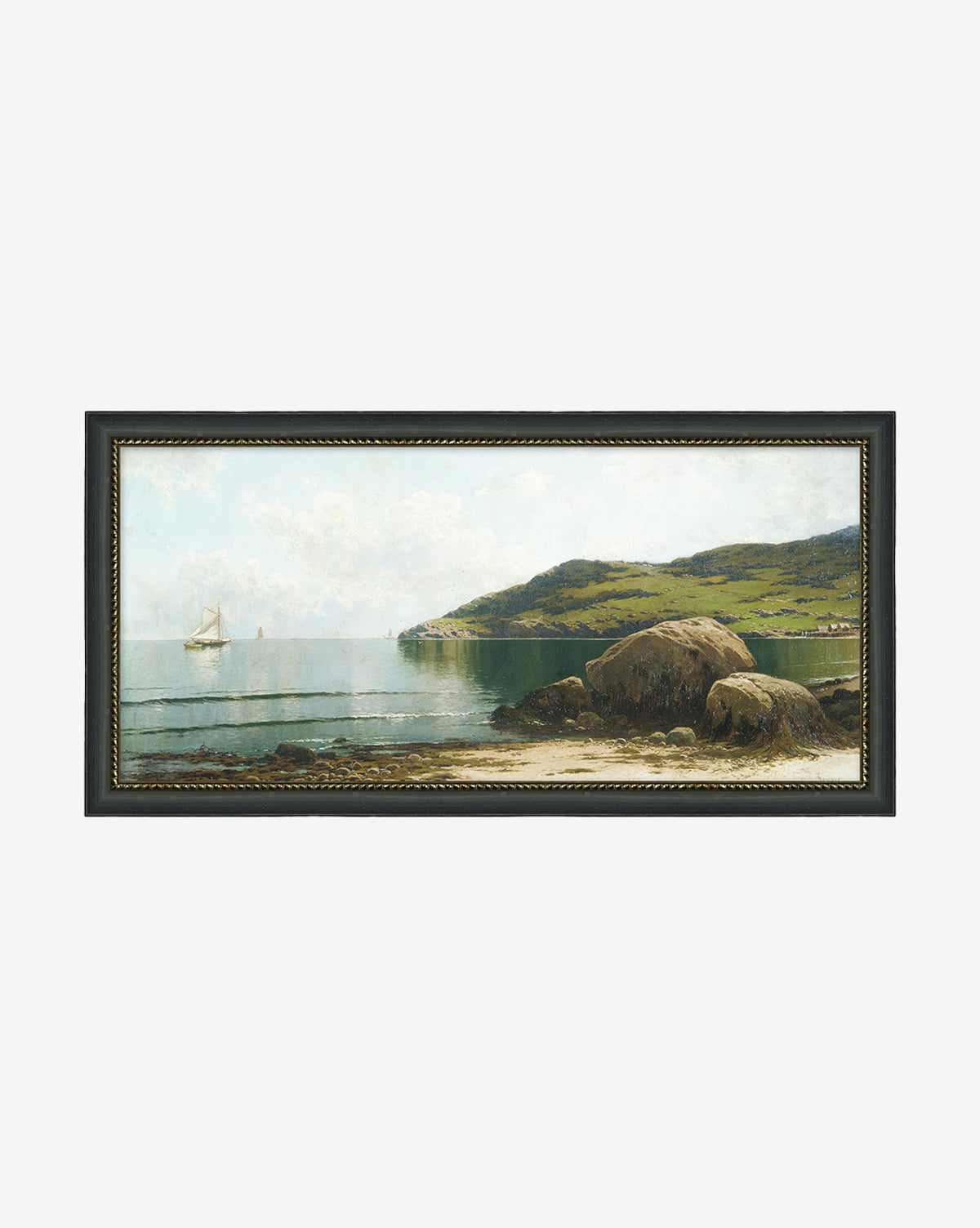 A gallery-quality framed painting from the Countryside Collection V features a tranquil coastal landscape with green hills, sandy shore with large rocks, and sailboats under a partly cloudy sky—the ideal wall art, by McGee & Co.