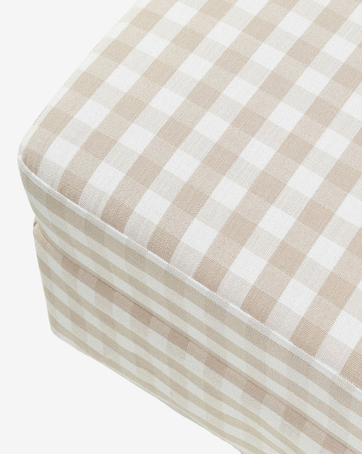 The Crawford Gliding Ottoman in Gingham by Million Dollar Baby features beige and white check fabric, adding charm to your nursery or living space. Shown against a white background. McGee & Co.