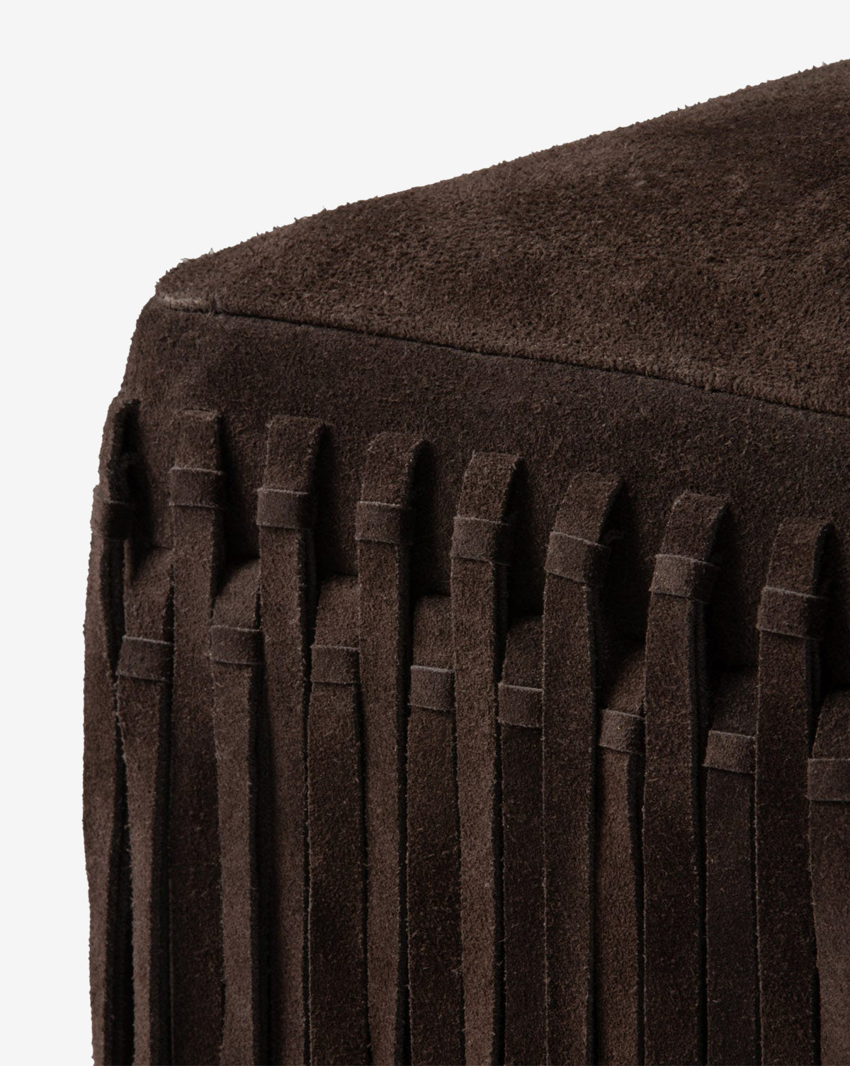 Close-up of the Made Goods Damian Ottoman in a rich camel color, showcasing vertical fringe accents on the sides and a smooth, suede-textured top. McGee & Co.