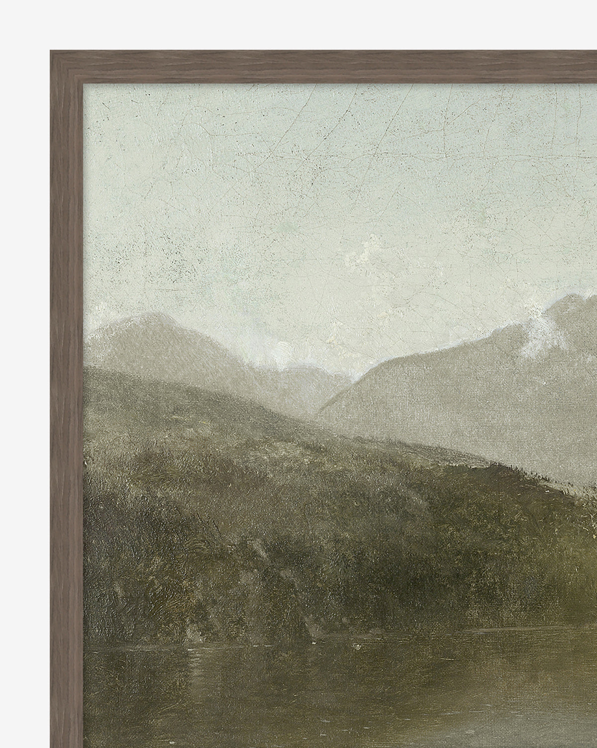 Darsey Lake Peaks is a framed landscape painting depicting green hills and a calm lake beneath a cloudy sky. Finished with an elegant walnut wood frame.