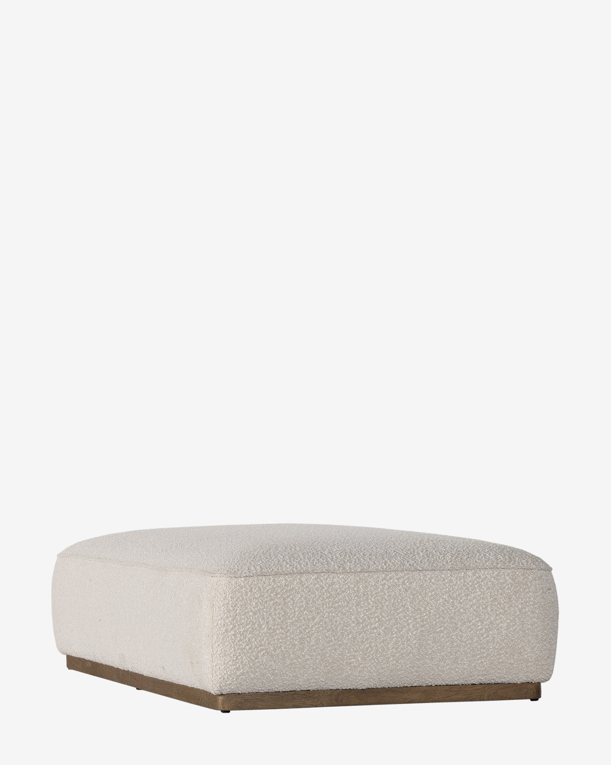 The Dawson Rectangular Ottoman by Four Hands features a low, square design in beige performance fabric with a flat top and slim parawood base, shown against a plain white background. McGee & Co.