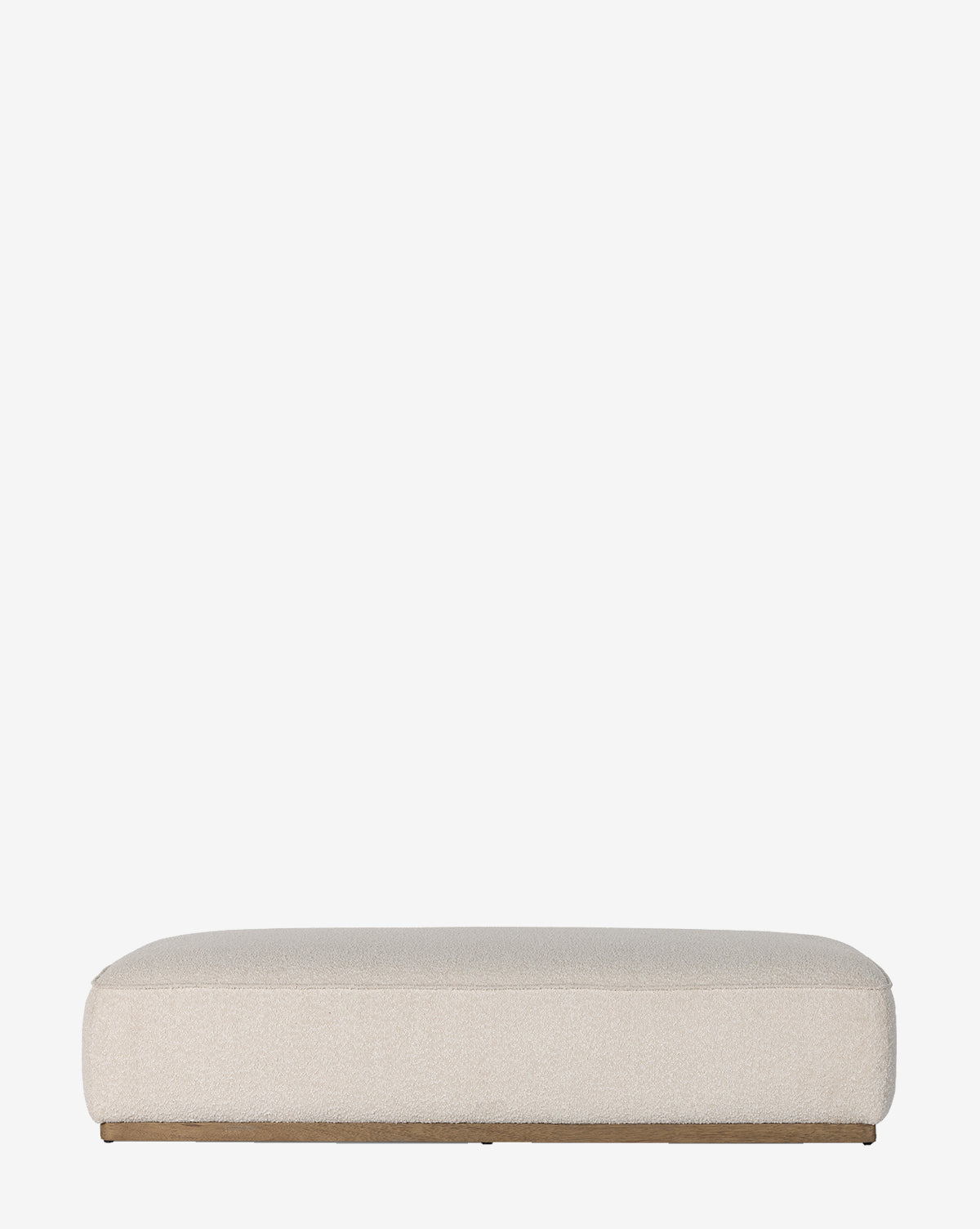 The Dawson Rectangular Ottoman by Four Hands features a low profile, flat top, rounded edges, and beige upholstery on a parawood base, shown against a plain white background. McGee & Co.